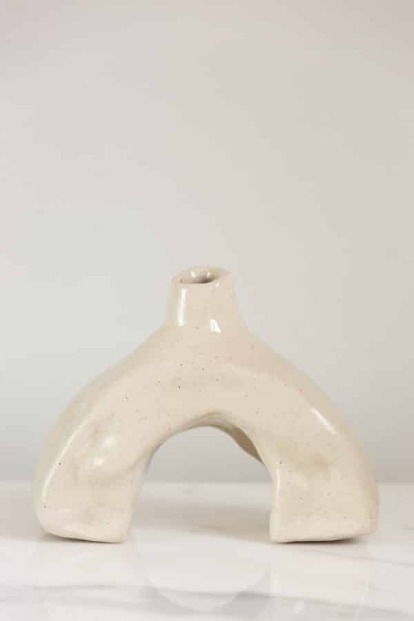 Small hand-built beige ceramic vase this is uniquely curved