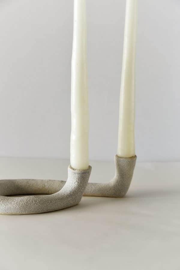 Close up of Double Stone Ceramic Taper Candle Holder "Letter G" with white taper candles inside