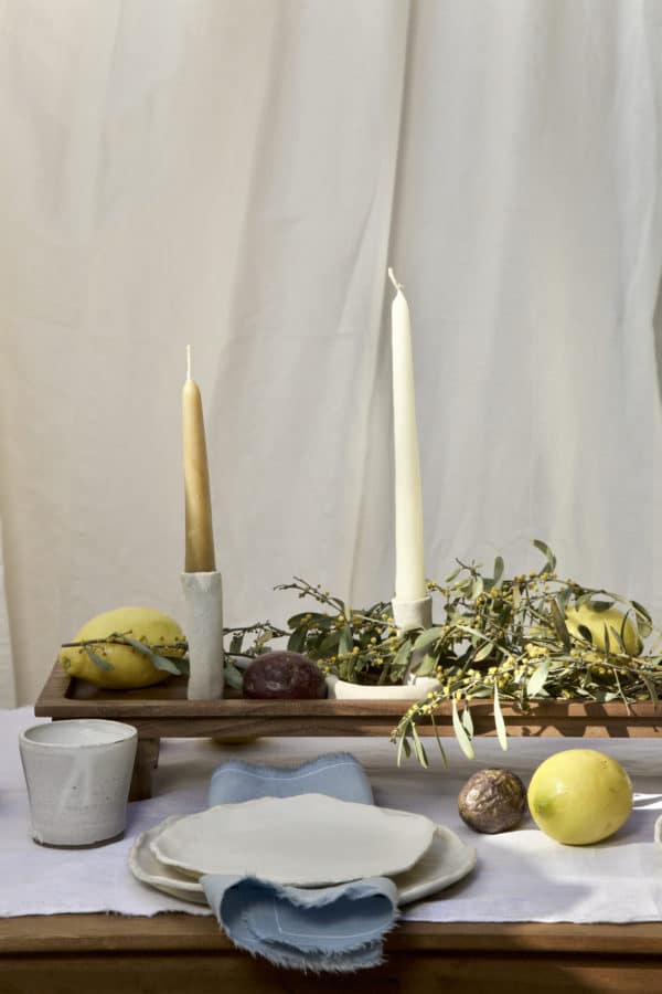 Springtime Tablescape with various Alliyah and Things products (Beewax taper candles, blue linen napkins, Stone with dinnerware set, White ceramic cups, stone double candle holder)