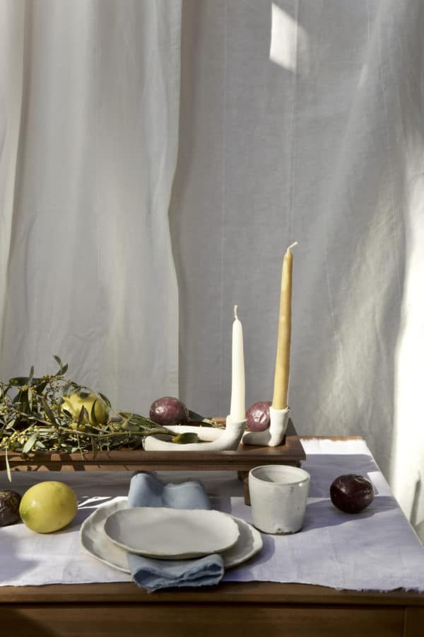 Springtime Tablescape with various Alliyah and Things products (Beewax taper candles, blue linen napkins, Stone with dinnerware set, White ceramic cups, stone double candle holder)