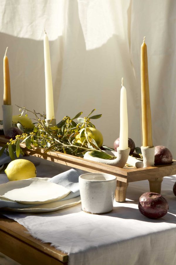 Springtime Tablescape with various Alliyah and Things products (Beewax taper candles, blue linen napkins, Stone with dinnerware set, White ceramic cups, stone double candle holder)