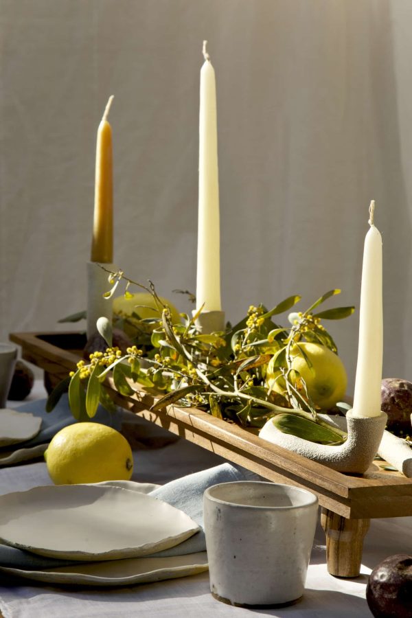 Springtime Tablescape with various Alliyah and Things products (Beewax taper candles, blue linen napkins, Stone with dinnerware set, White ceramic cups, stone double candle holder)