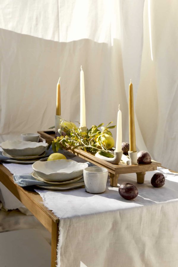 Springtime Tablescape with various Alliyah and Things products (Beewax taper candles, blue linen napkins, Stone with dinnerware set, White ceramic cups, stone double candle holder)